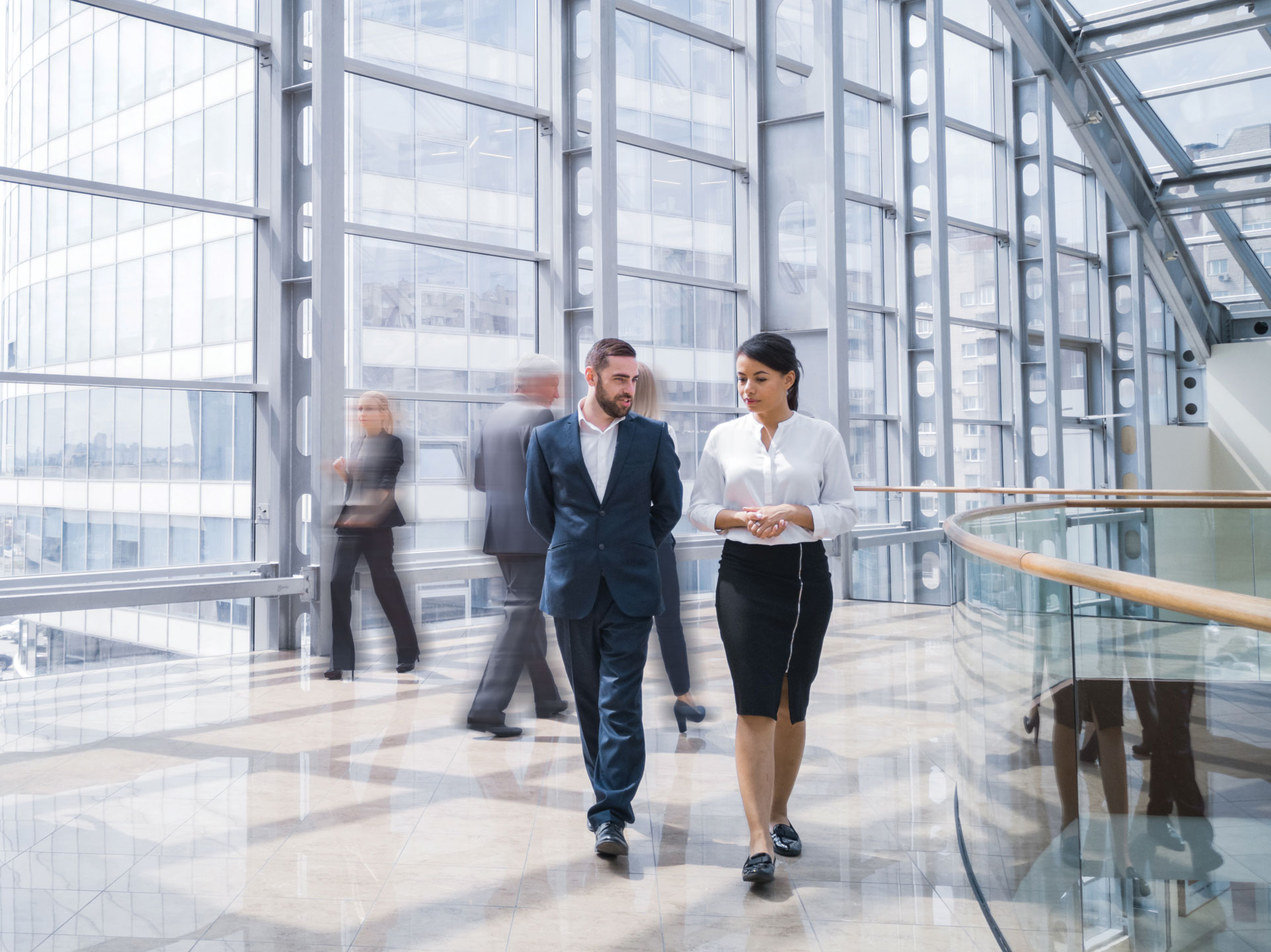 Two businesspeople walking and talking