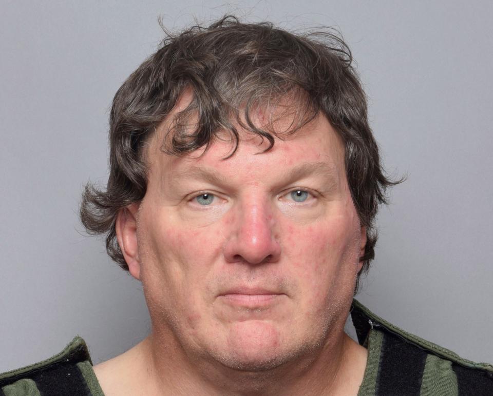 This booking image provided by Suffolk The mugshot of Rex Heuermann, the Long Island charged with murder in the deaths of three of the 11 victims in a long-unsolved string of killings known as the Gilgo Beach murders.