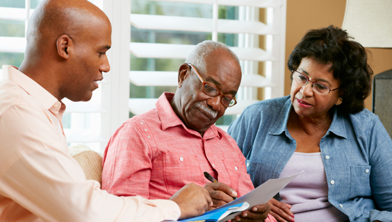 Older couple getting help with legal and financial documents